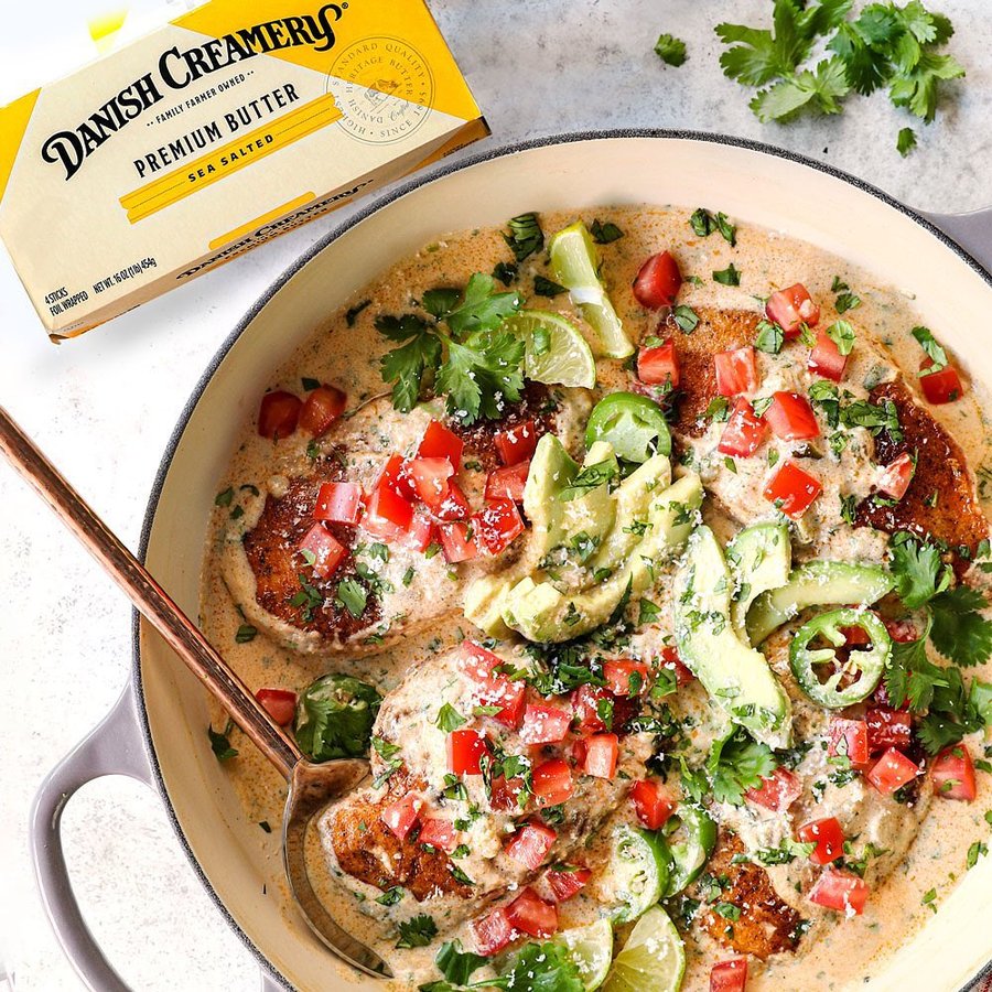 Instagram post by @carlsbadcravings for The Kitchn. Caption reads: #ad This Smothered Chicken with Green Chili Sour....