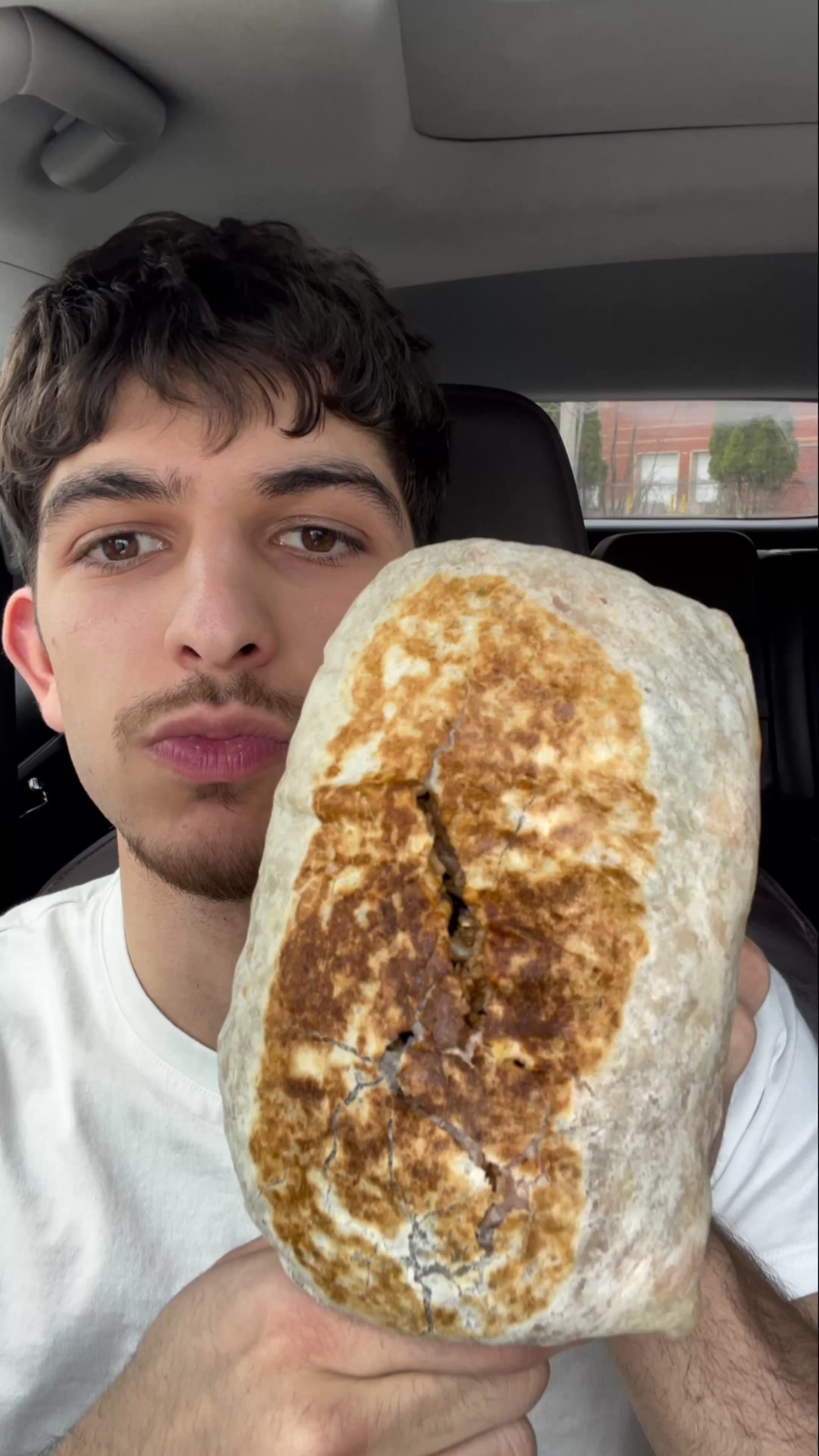 TikTok post by @baklaeats for Takis. Caption reads: Giant Burrito X Takis 🥵 @Quesada Burritos @Takis....