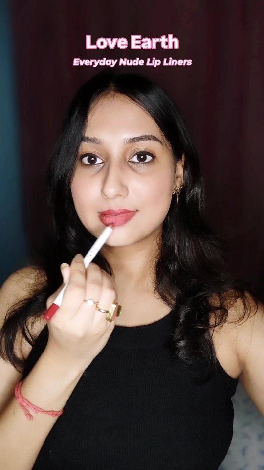 Instagram post by @iamdeblinaa for LOVE EARTH. Caption reads: Trying out @loveearth_handmade Everyday Nude Lip....