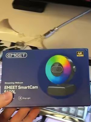 TikTok post by @tron1xtech for EMEET. Caption reads: EMEET S600L 4K WEBCAM REVIEW! Thanks to [...].