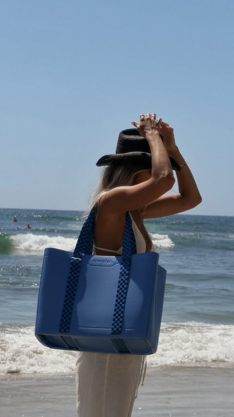 Instagram post by @taylornicolehayden for Owala. Caption reads: Surf, sun, salt, and this @owala tote that holds....