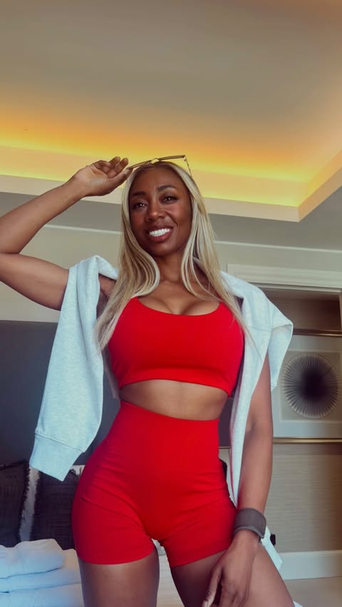 Instagram post by @_tomiakande_ for Fabletics. Caption reads: [...] in this red hot set, courtesy of....