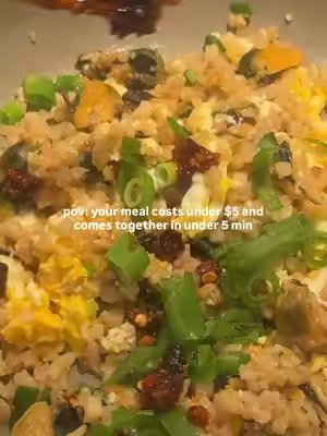 TikTok post by @careeseeats for Trader Joe's. Caption reads: [...] everyday!!! $5 MUSSELS FRIED RICE @Trader....
