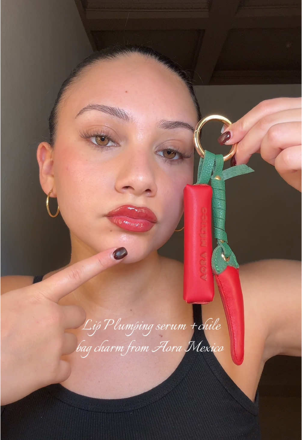 TikTok post by @kellylandsman for Aora Makeup. Caption reads: The spiciest red lip ❤️ @Aora Makeup US....