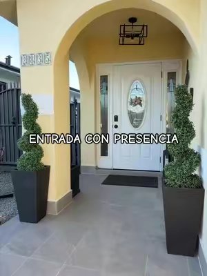 TikTok post by @yaneabreu_ for Vevor Outdoor Store US. Caption reads: VEVOR set of 2 artificial spiral topiary trees 🌿....