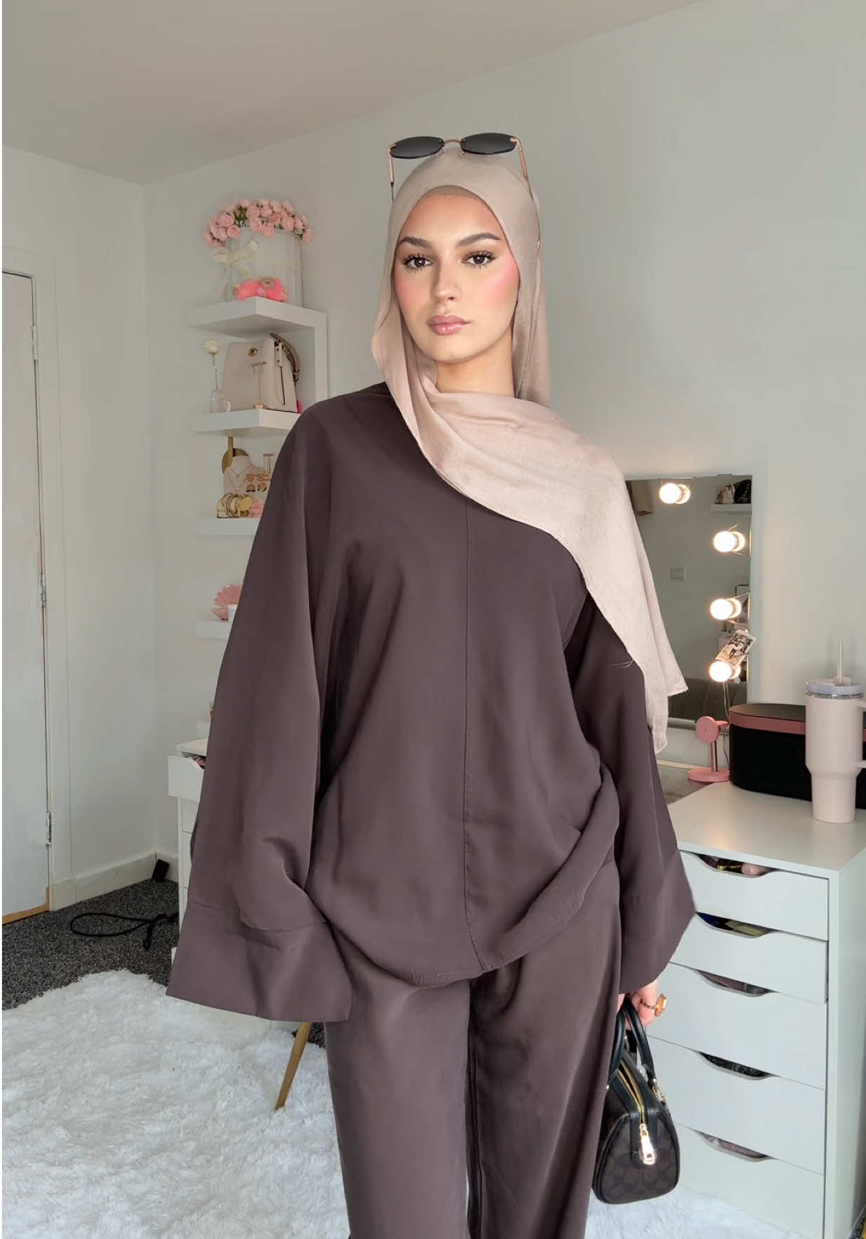 TikTok post by @somaya._xx for emlavish. Caption reads: [...] #outfitinspo #hijabifashion #coordset....