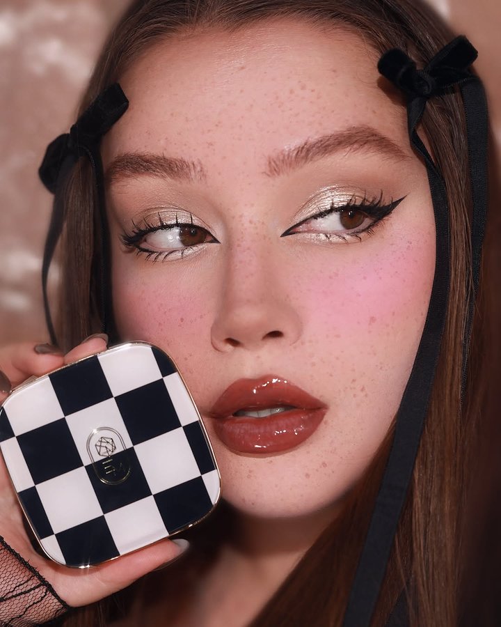Instagram post by @olgadann for EM Cosmetics. Caption reads: Magic touch with @emcosmetics ✨ ⠀⠀ Used: Sheer -....
