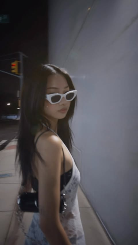 Instagram post by @xinyiidng for Sunglass Hut. Caption reads: [...] essential everywhere I go 🤍 @rayban....