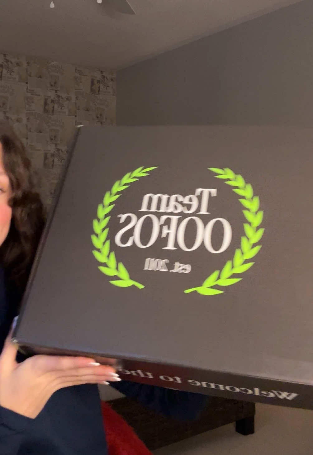 TikTok post by @_.brooklyntaylor for Her Campus. Caption reads: PR UNBOXING FROM @OOFOS + @hercampus  #TeamOOFOS....