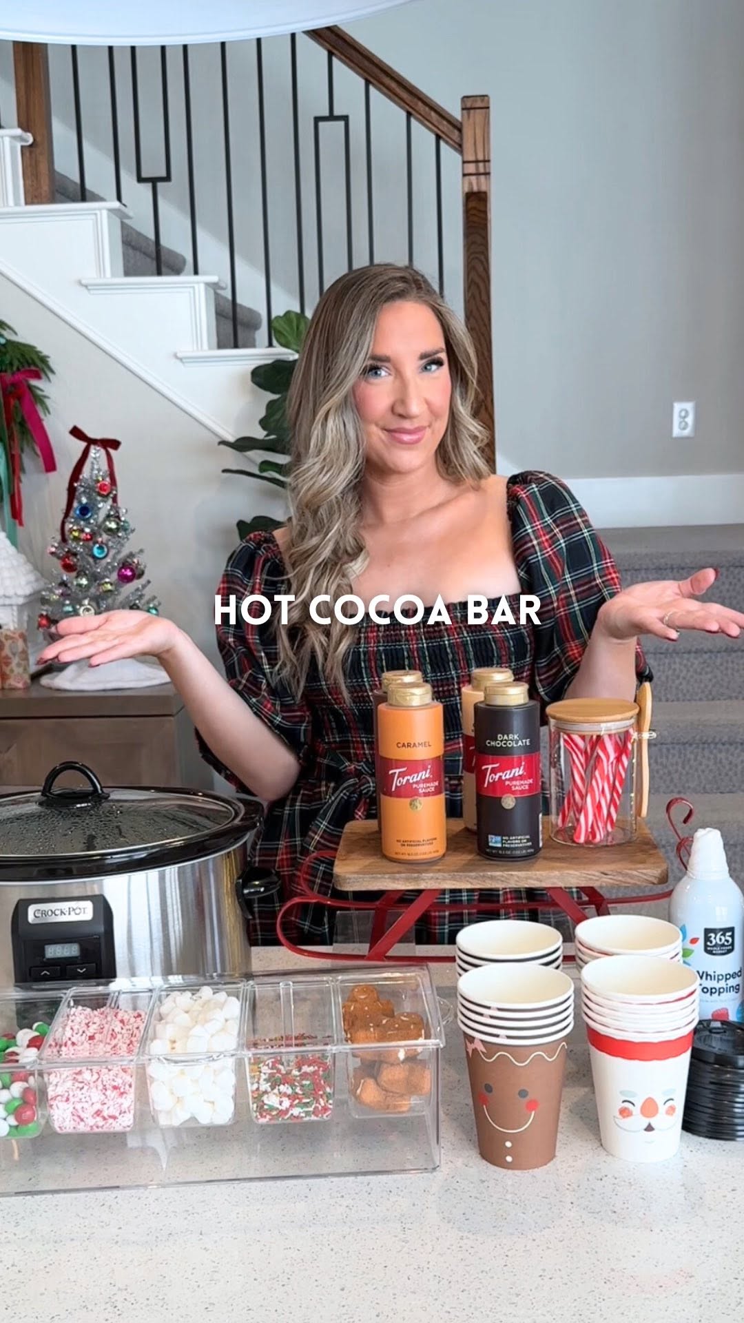 Instagram post by @kristinnicolemiller_ for Amazon Fresh. Caption reads: Hot cocoa bar for christmas🎄Comment “cozy” to get....