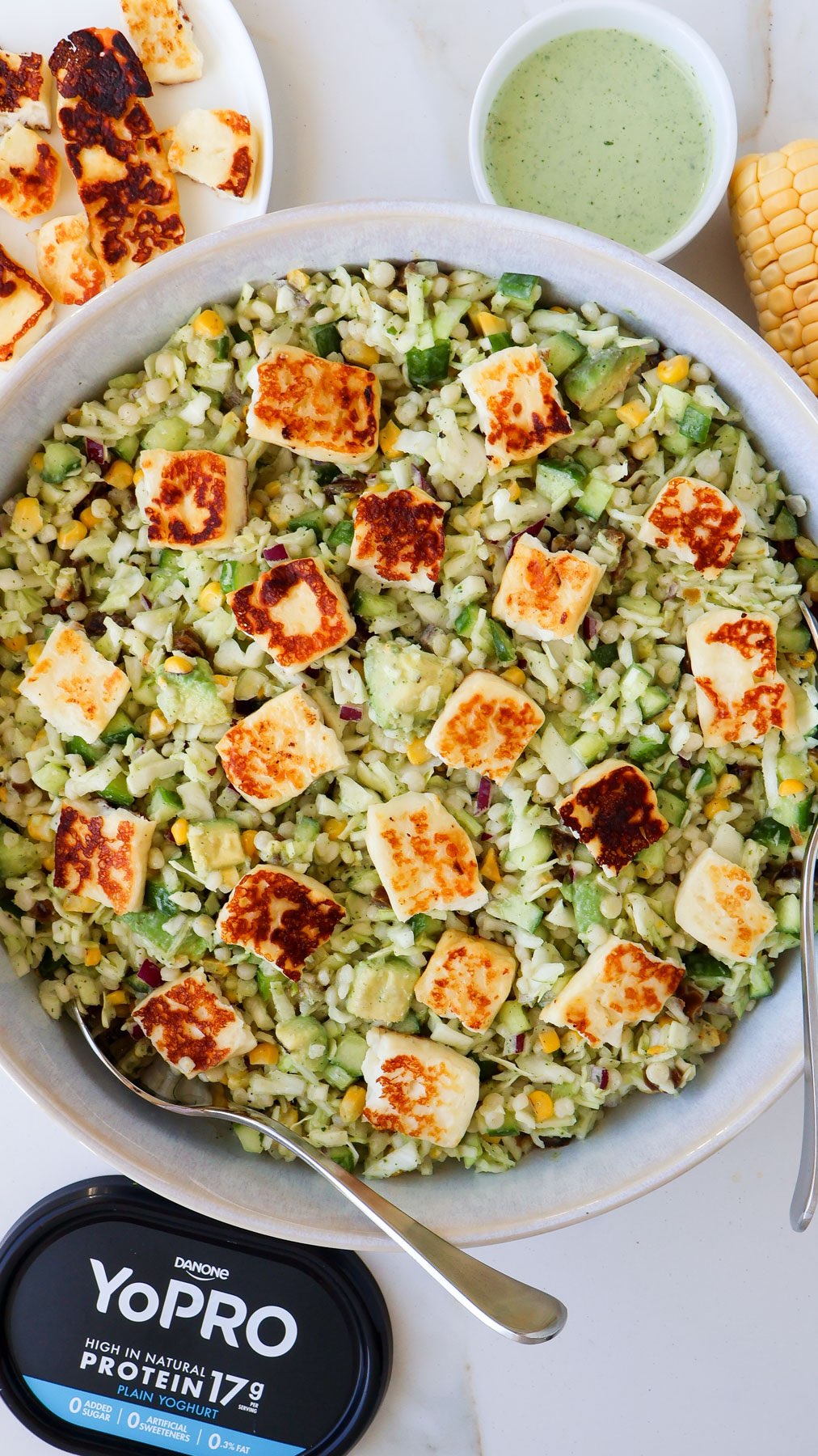 Instagram post by @goodnessavenue for YoPRO. Caption reads: this HALLOUMI COUSCOUS SALAD is crunchy, a little....