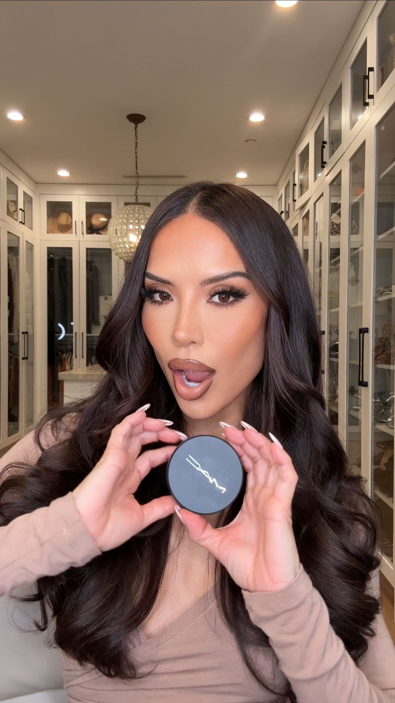 Instagram post by an influencer for M·A·C Cosmetics. Caption reads: [...] powder just got an upgrade @maccosmetics ✨....