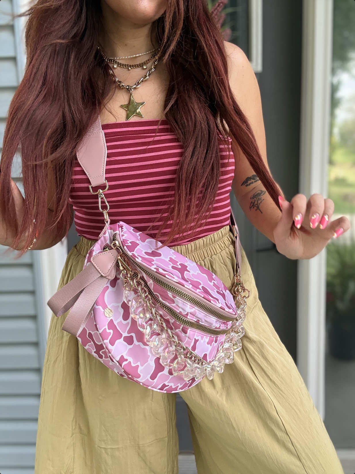 TikTok post by an influencer for Gold Blush. Caption reads: Obsessed 😍💖🤭 @Gold Blush #bumbag #pinkcamo....
