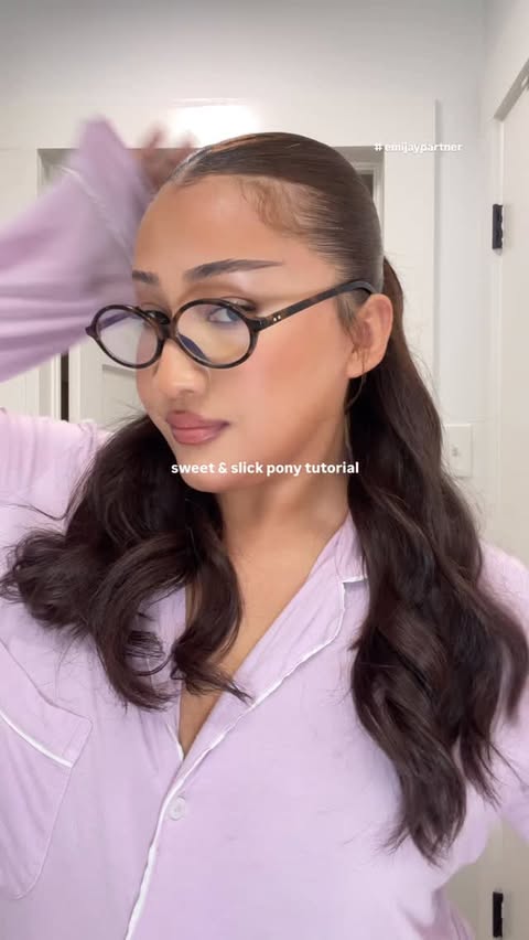 Instagram post by @raquelxzuleyma for Emi Jay. Caption reads: [...] back ponytail tutorial 🦢☁️🫧🪽 with....