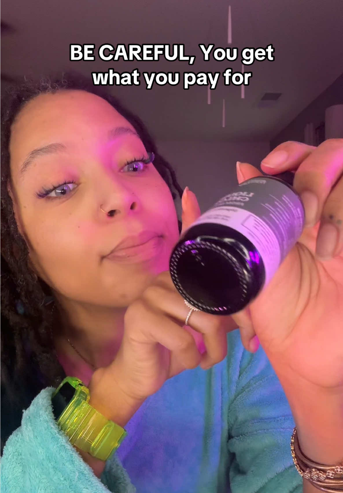 TikTok post by @zheaqueenmusic for Earth Harmony. Caption reads: [...] a bottle of water and food coloring. @Earth....