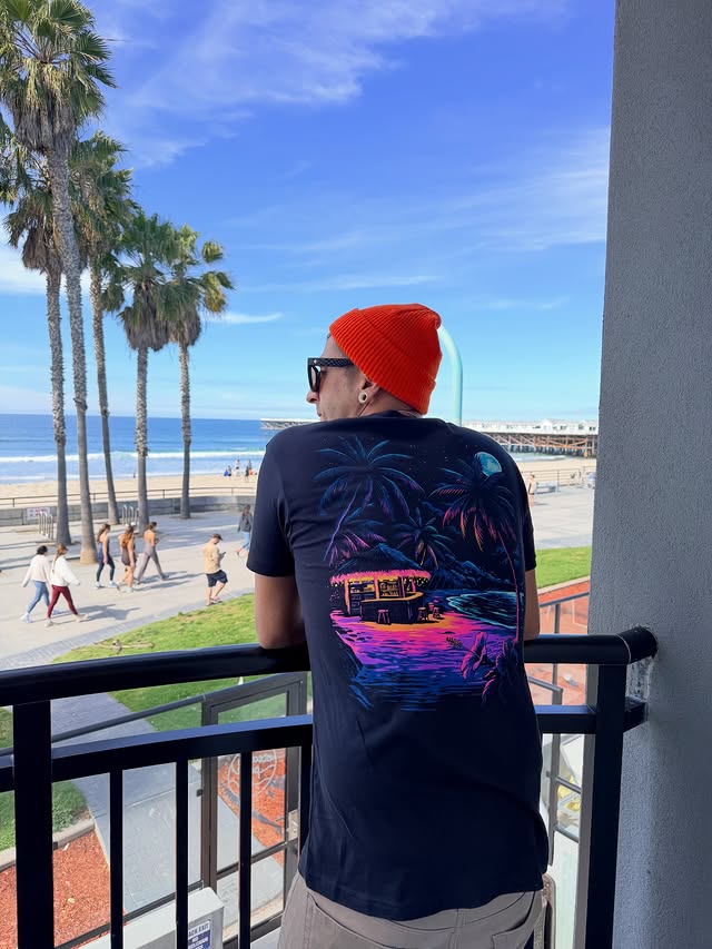 Instagram post by @adventurewithhongie for INTO THE AM. Caption reads: [...] has been wearing these tees from @intotheam....
