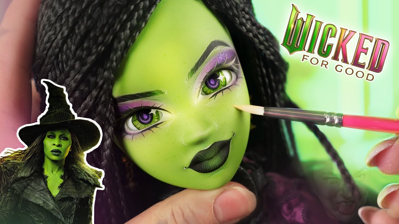 YouTube post by @Enchanterium for Shop Titans. Caption reads: We made ELPHABA from WICKED 💚 Green Smart Doll....
