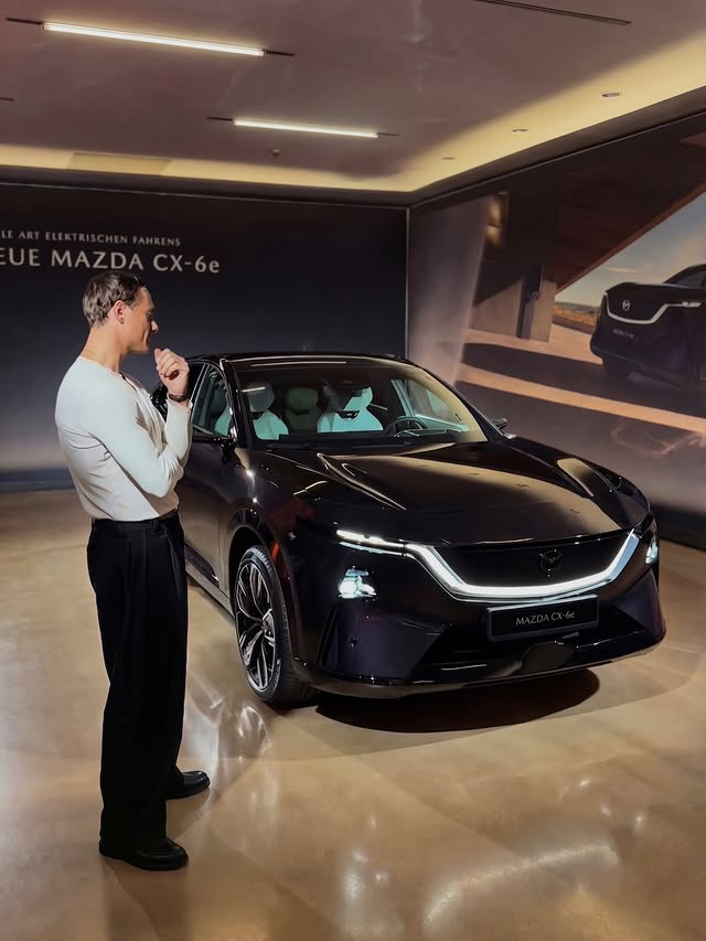 Instagram post by an influencer for Mazda Deutschland. Caption reads: Experiencing the new @mazda_de CX-6e through a....