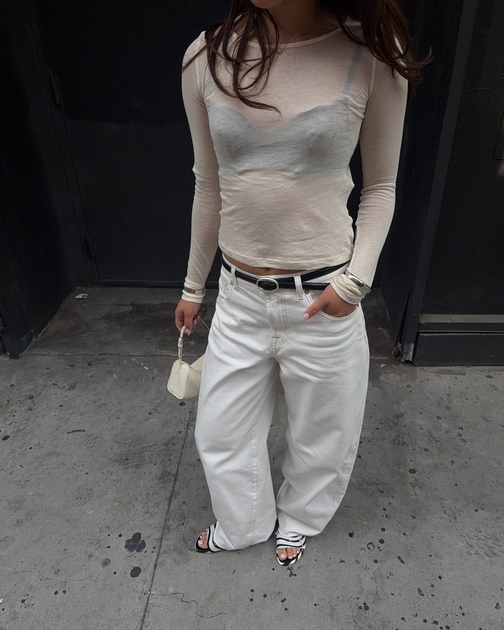 Instagram post by an influencer for 7 For All Mankind. Caption reads: all white in @7forallmankind #7FAM #ad.