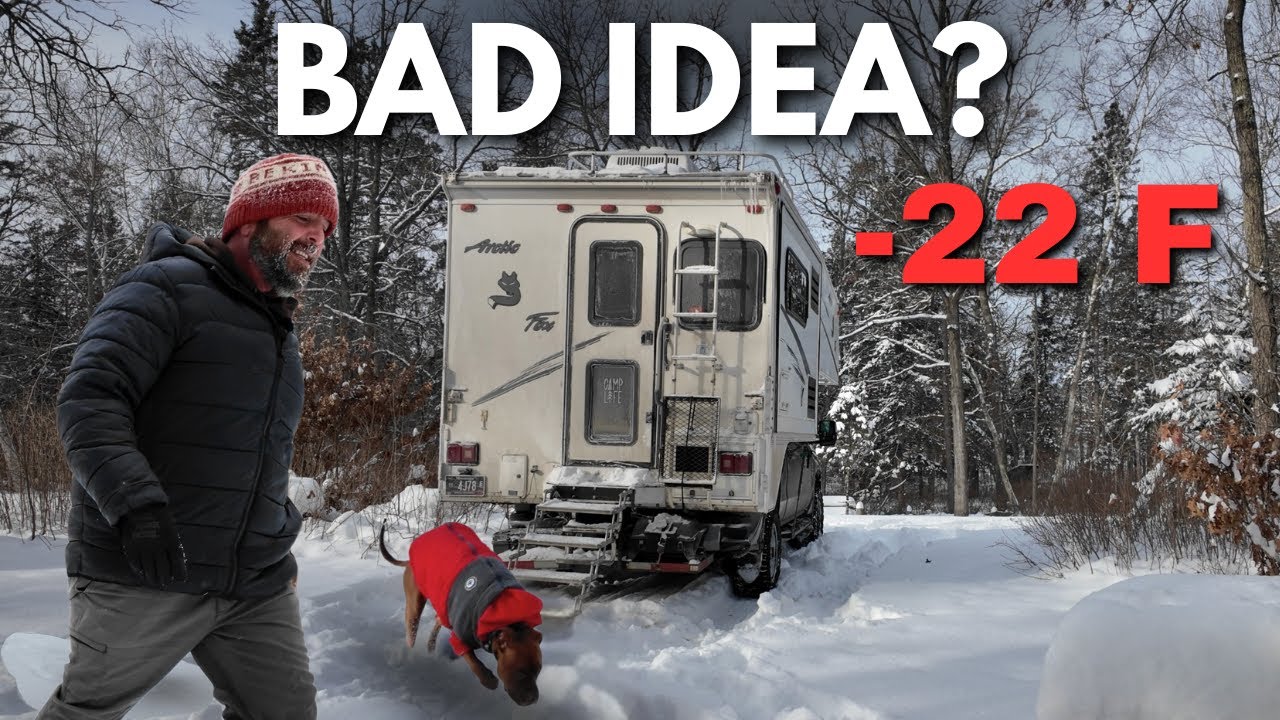 YouTube post by @KennyOfAllTrades for WOLFBOX. Caption reads: Winter Truck Camping Alone in –22°F....