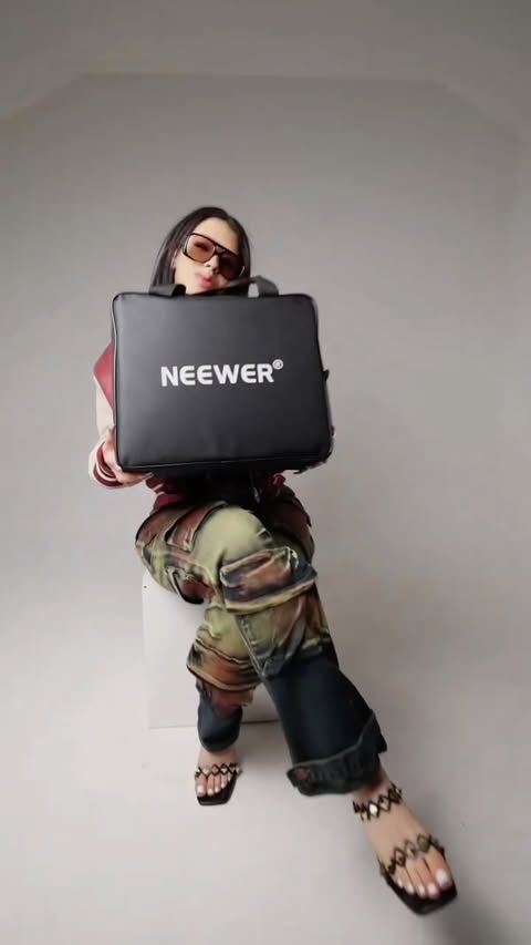 Instagram post by @slayinwithamy for NEEWER. Caption reads: STAY SHINING ✨ @neewer never fails to serve all....