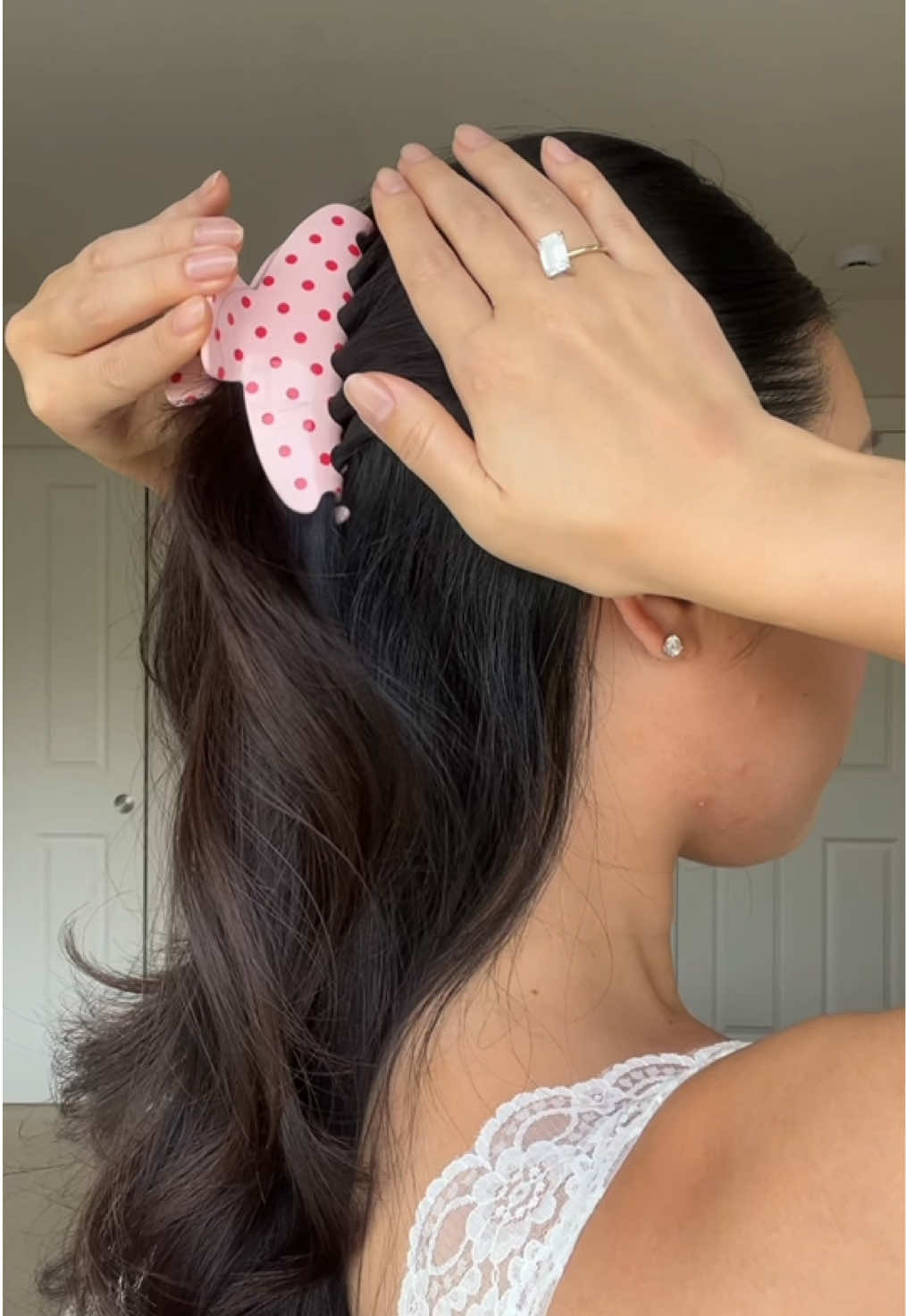 TikTok post by @angelaypark for Emi Jay. Caption reads: [...] that lingers in your hair, introducing @Emi....