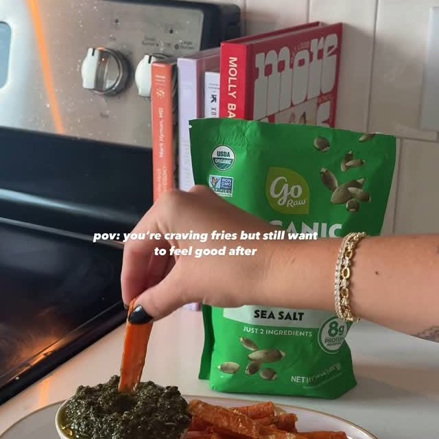 Instagram post by @liv.ingwell for Go Raw. Caption reads: Carrot fries with a sprouted seed pesto — my go-to....