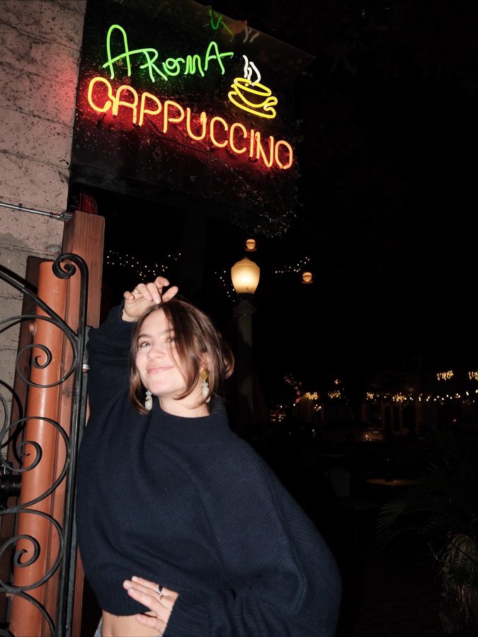 Instagram post by @maggiethurmon for Sezane. Caption reads: Big ol cup of hot chocolate, it’s so fall @sezane....