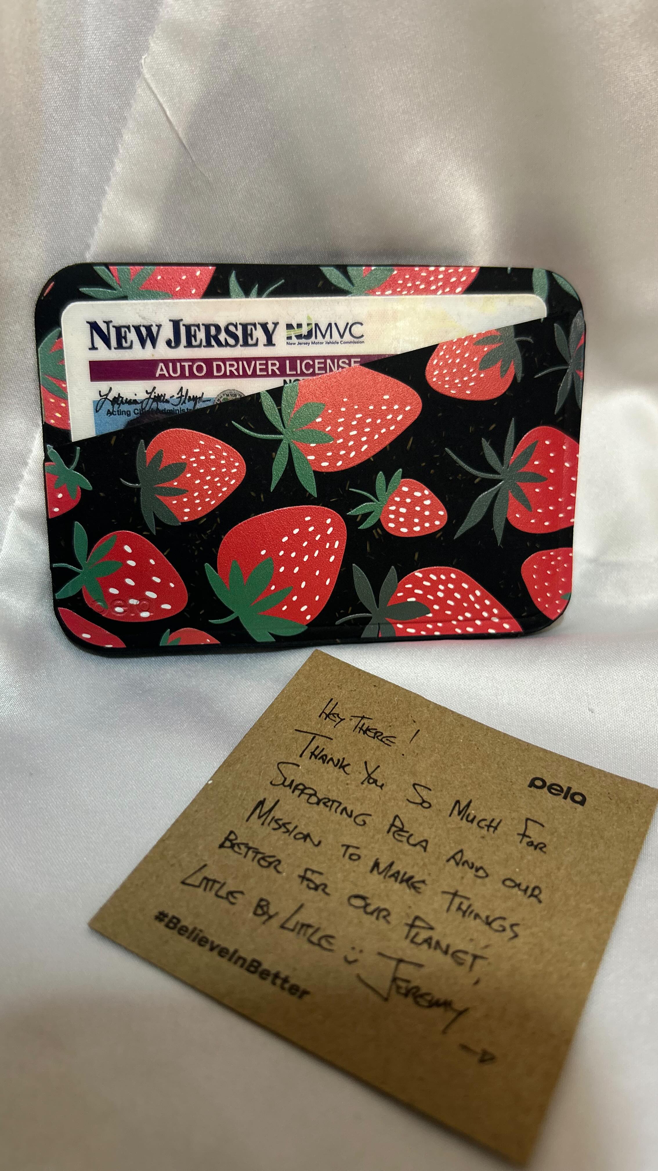 Instagram post by @mariamotskhoidze for Pela Case. Caption reads: My Pela cardholder 🍓 @pelacase 🍓.