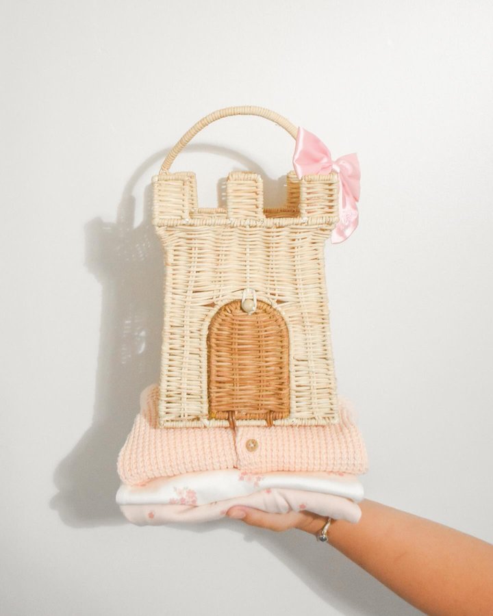 Instagram post by @alyssacherise for Olli Ella. Caption reads: there is a castle on a cloud ☁️ #sponsored our....