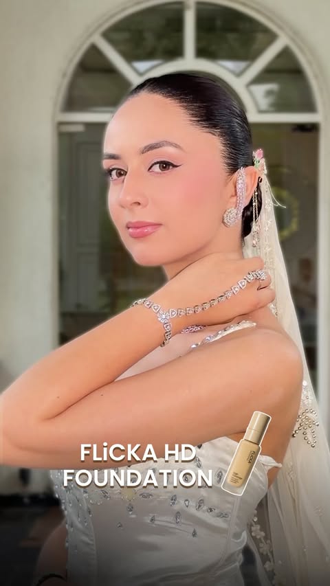 Instagram post by @monikabhandari_makeupartistry for Flicka Cosmetics. Caption reads: Luxury Base. Effortless Perfection. ✨ A flawless....