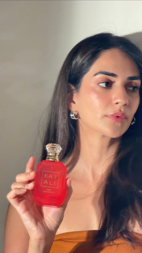 Instagram post by @karmaadhir for KAYALI FRAGRANCES. Caption reads: #ad the girls who get it… get it 🍑🍐 the NEW....