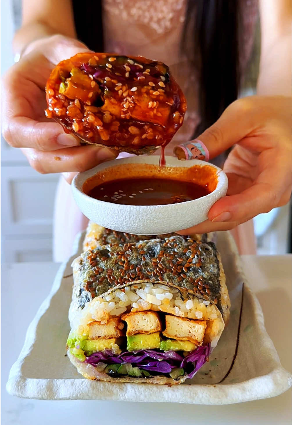 TikTok post by @veganbunnyelle for Gimme Seaweed. Caption reads: CRISPY Rice paper gochujang Gimbap rolls 💥🤤 with....