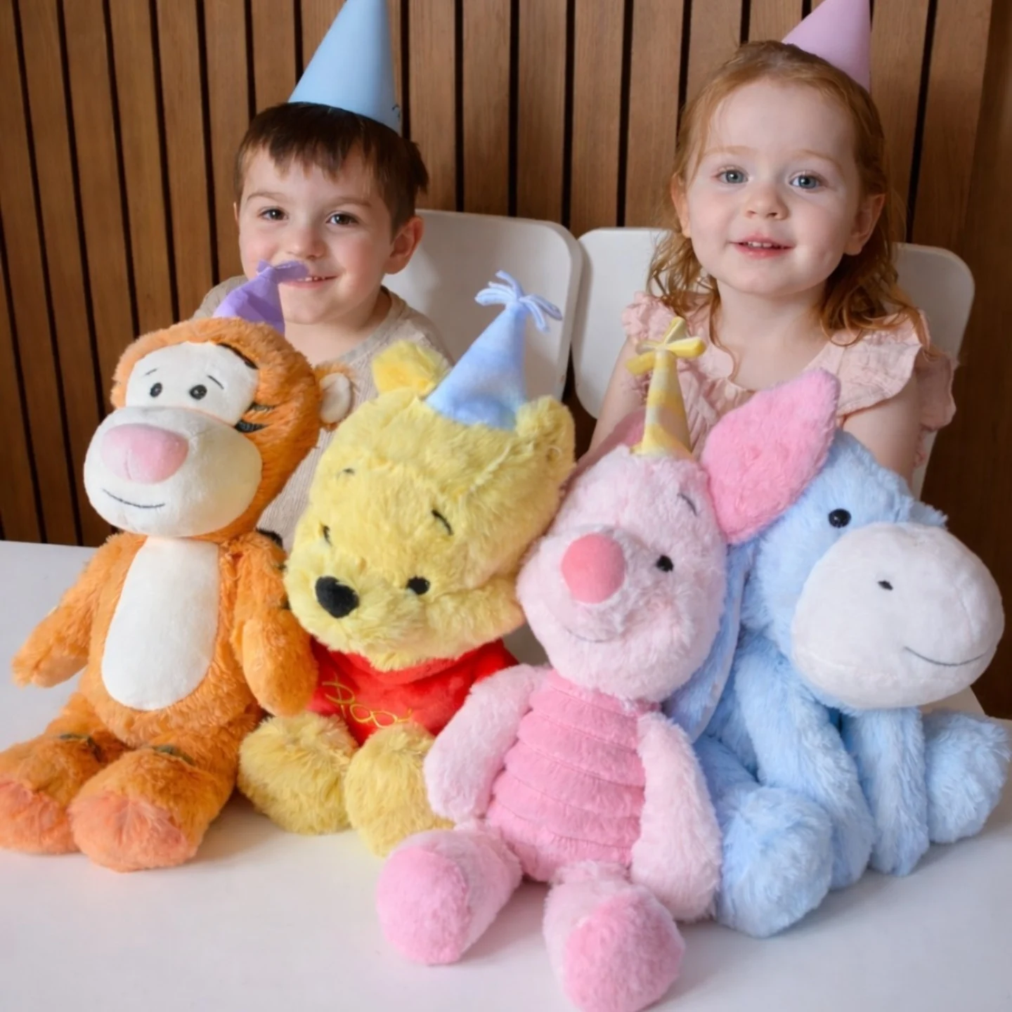 Instagram post by @_the_watts_family for The Entertainer Toys. Caption reads: #AD We’ve been celebrating 100 years of Disney....