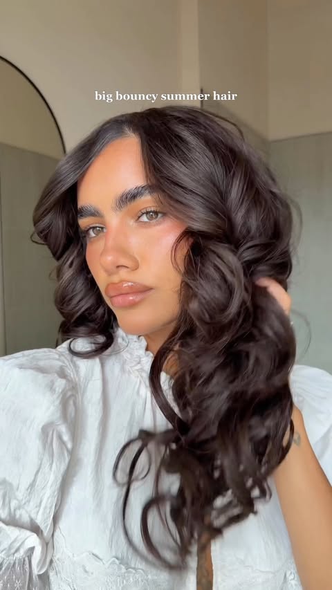 Instagram post by @luisapiou for amika. Caption reads: big bouncy summer curls step by step @amika....