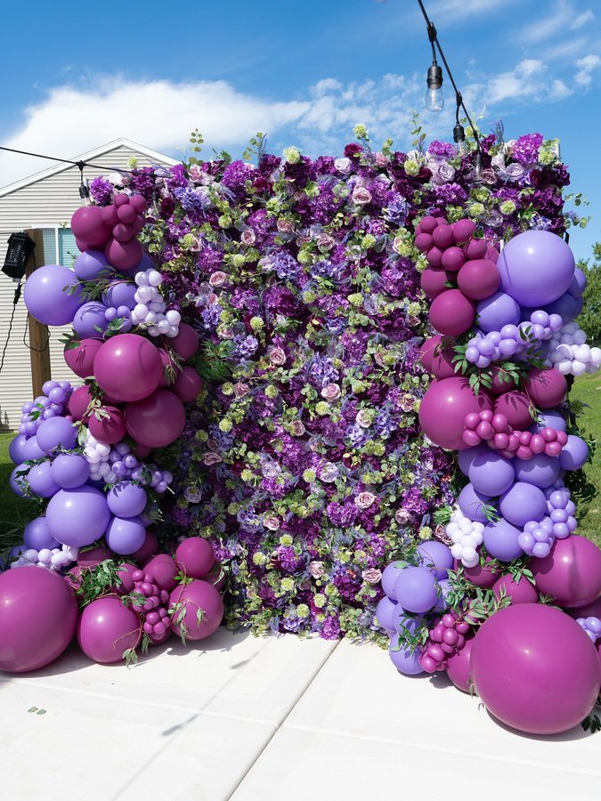 Instagram post by @e.layups for KetieStory. Caption reads: [...] this beautiful Purple Flower Wall by....