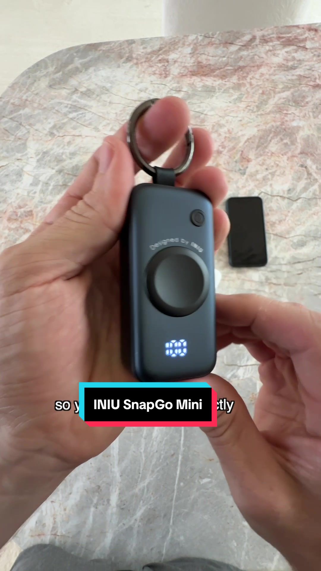 TikTok post by @trutech for INIU. Caption reads: [...] this unique mini portable power bank. The....