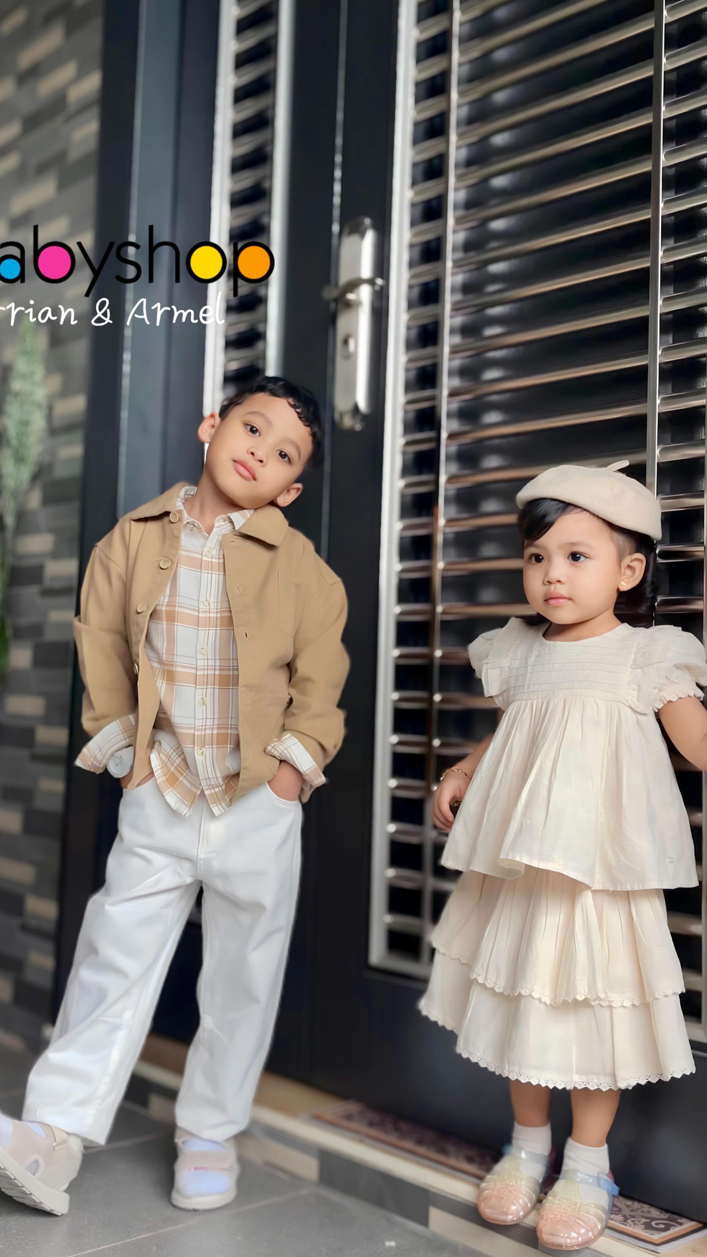 Instagram post by @qeelaree for Babyshop. Caption reads: ✨ Mini models in the house! ✨

Both my son and....