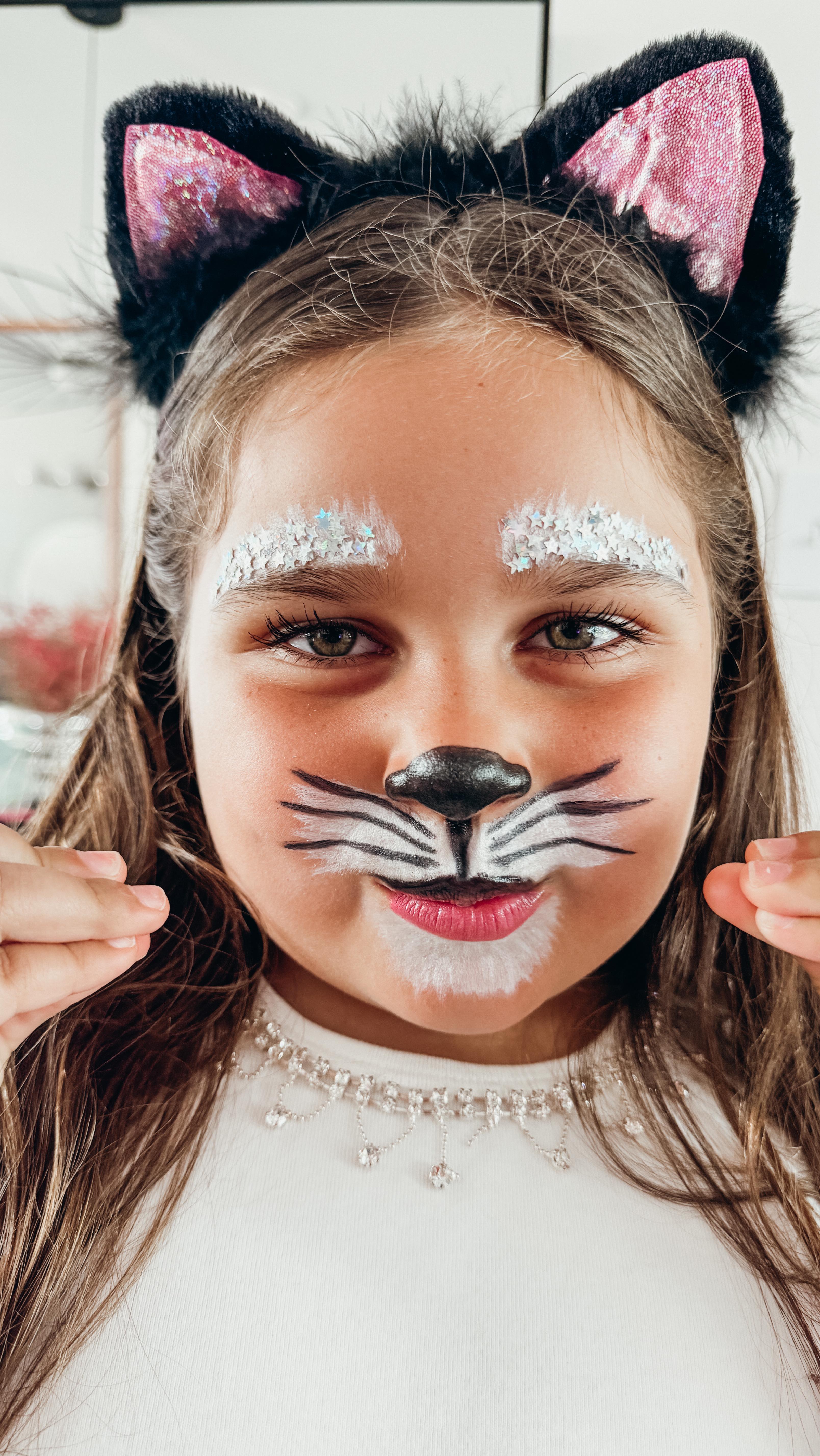 Instagram post by @selenadavis for Walmartpr. Caption reads: Catalina's 5min halloween makeup 😽💘✨ #ad....