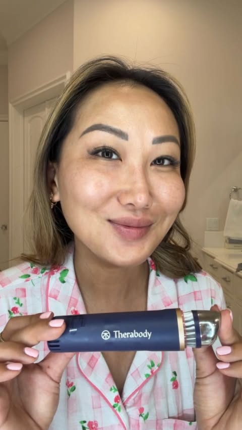 Instagram post by @tiffanymoonmd for Therabody. Caption reads: [...] with my TheraFace Depuffing Wand by....