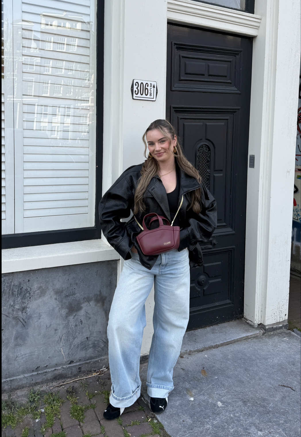 TikTok post by @demivdmeijden for CLUSE. Caption reads: [...] cherry red voor elke outfit 🍒 Tasje: @CLUSE....