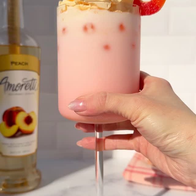 Instagram post by @sugarpusher for Amoretti. Caption reads: Summer is on the way, and this peach ring Italian....
