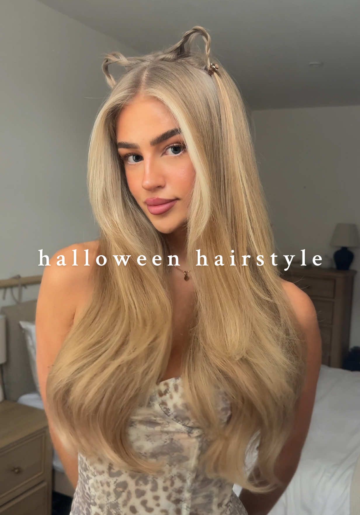 TikTok post by @hollyjai_ for MONDAY Haircare. Caption reads: Last minute Halloween hairstyle🐈‍⬛🎃✨ I used....
