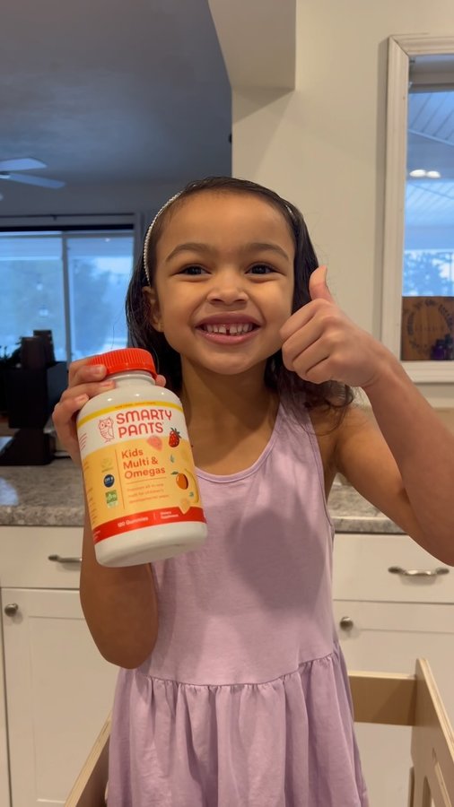 Instagram post by @yourstruly_thehensleys for SmartyPants Vitamins. Caption reads: #smartypantspartner Tiny Humans are just as busy....