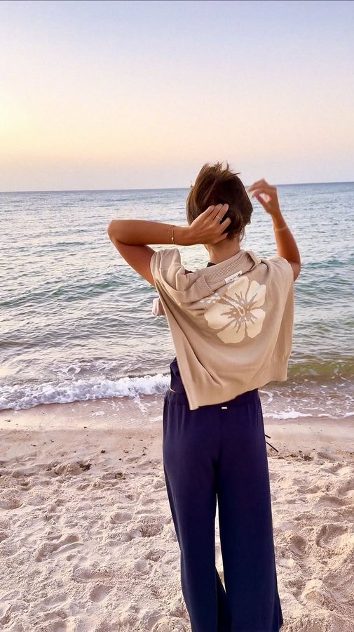 Instagram post by @eloisemumme for Okanui. Caption reads: Warm summer nights 🐬👙🫧 @okanuiclassics 

#ad.