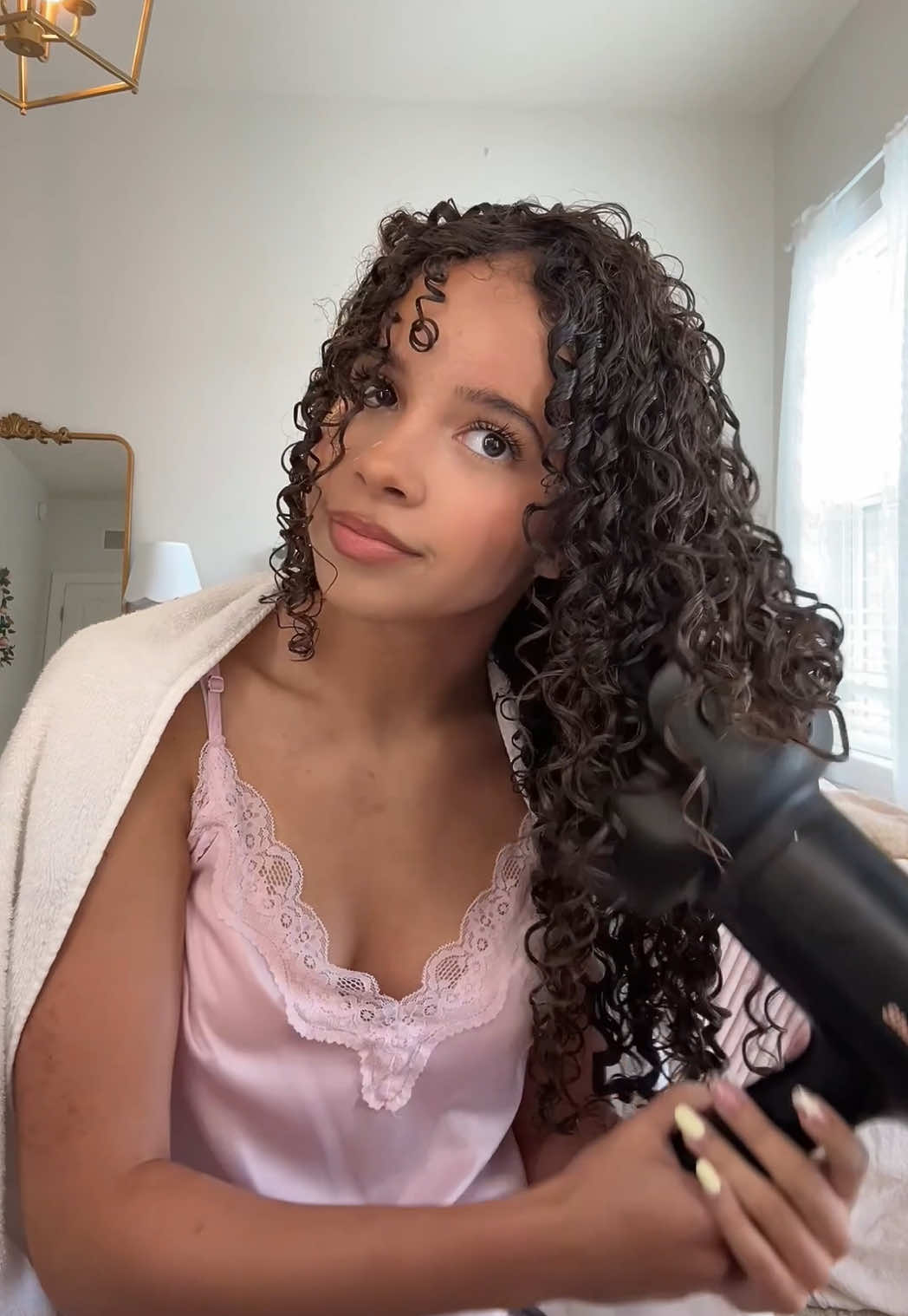 TikTok post by @lovekennedyrae for Not Your Mother's. Caption reads: Curls didn’t get the memo this morning, so I hit....