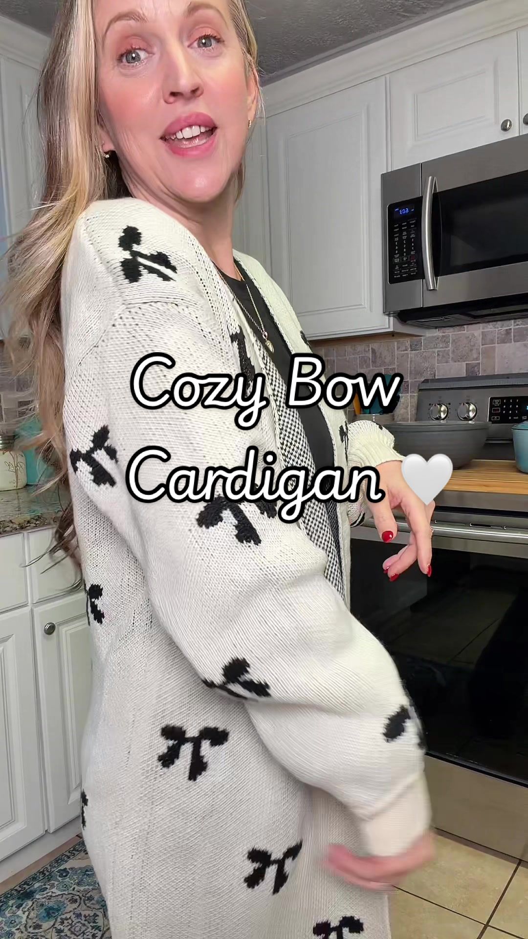 TikTok post by @tinastripling for YouAnnn. Caption reads: Cozy Bow Cardigan 🤍 @YouAnnn #cardiganstyle....