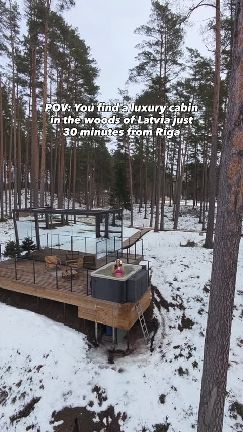 Instagram post by @travelsofsarahfay for @hotel. Caption reads: Sometimes you just need to escape to the woods for....