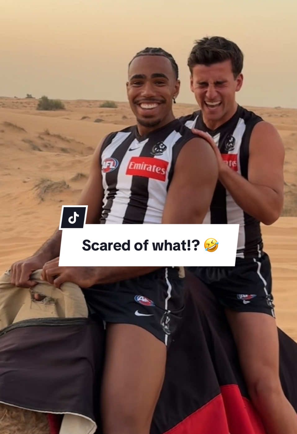 TikTok post by @collingwoodfc for Emirates. Caption reads: Athletes try riding camels in the Dubai dessert....