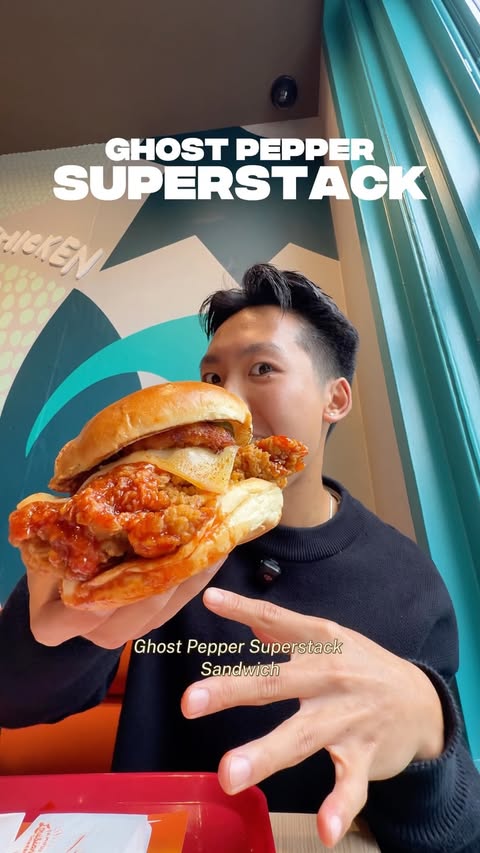 Instagram post by @phoodndrinx for Popeyes. Caption reads: [...] The Ghost Pepper Superstack Sandwich is....